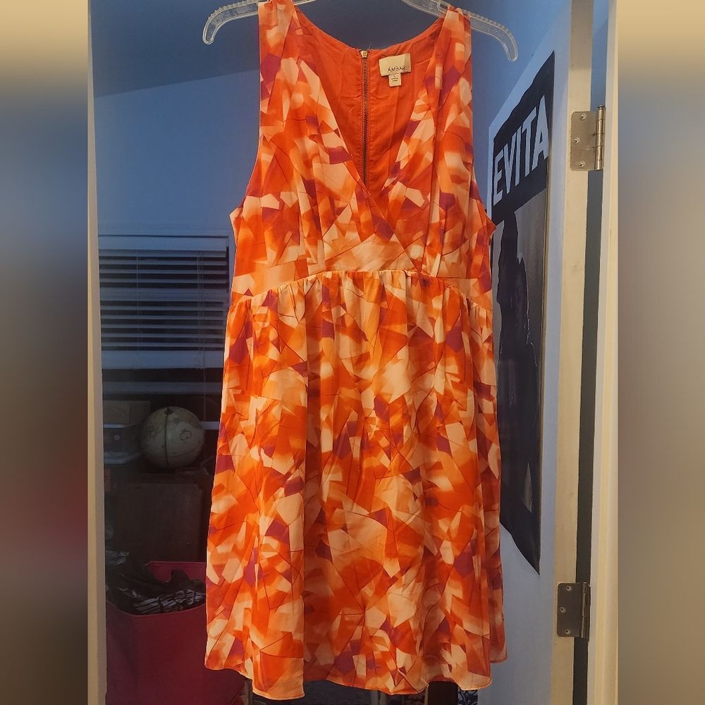 Like new, never worn. Sleeveless, v-neck dress